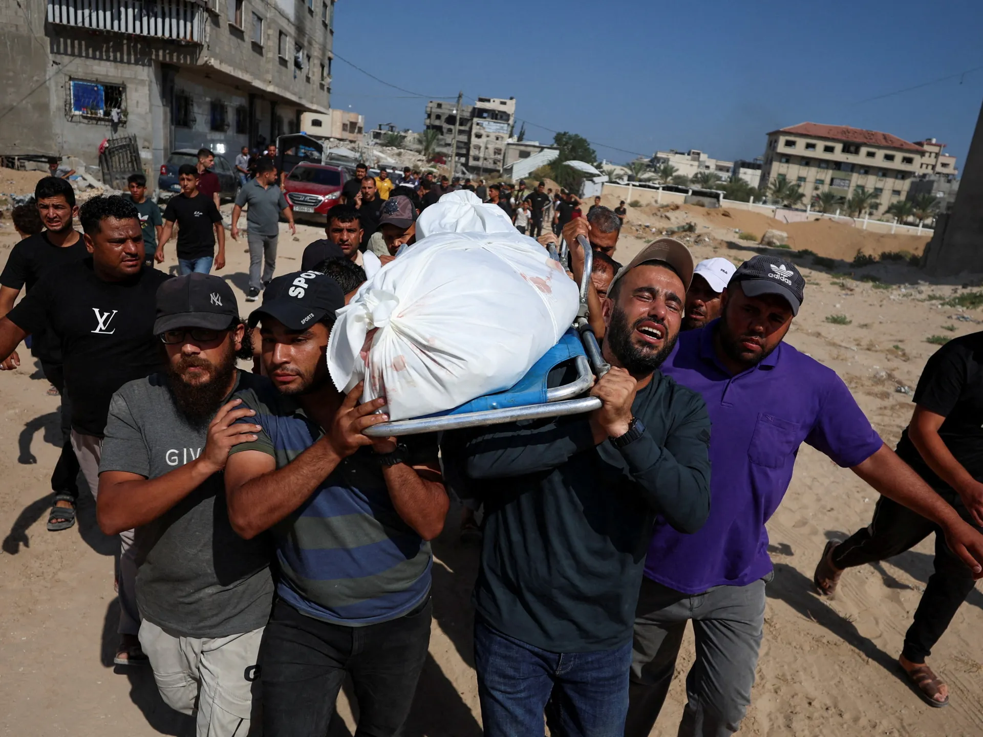 Iran war live: Khamenei’s body arrives in Qom, Hamas cedes Gaza governance