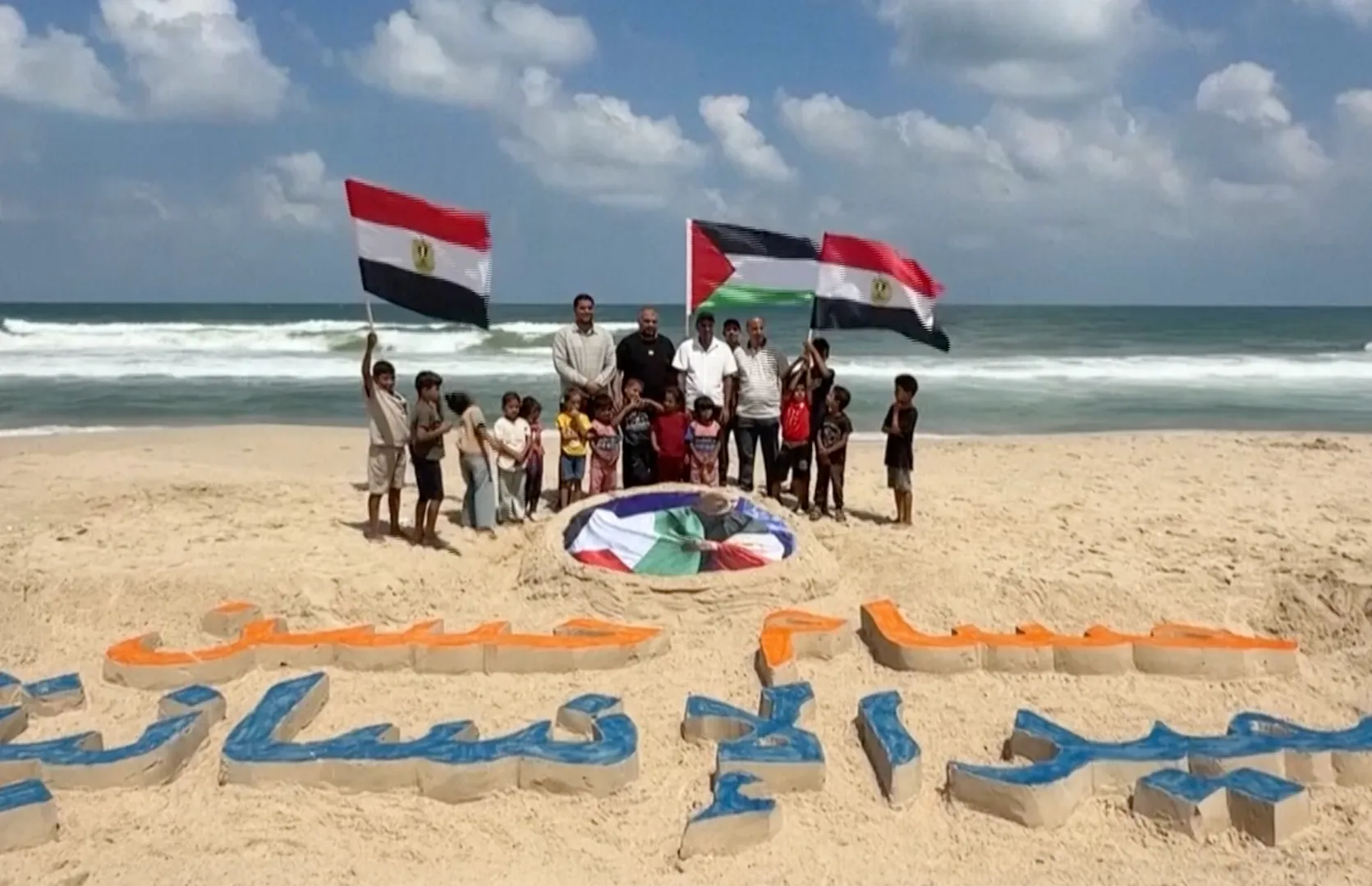Gaza artists honour Egypt coach Hossam Hassan with sand portrait