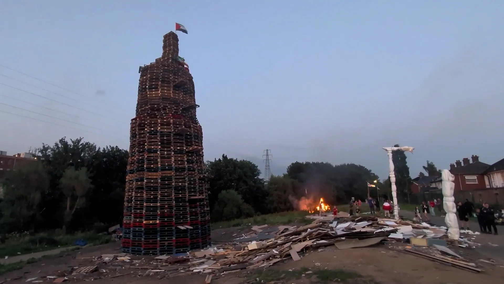 Anti-migrant display set alight in Northern Ireland bonfire