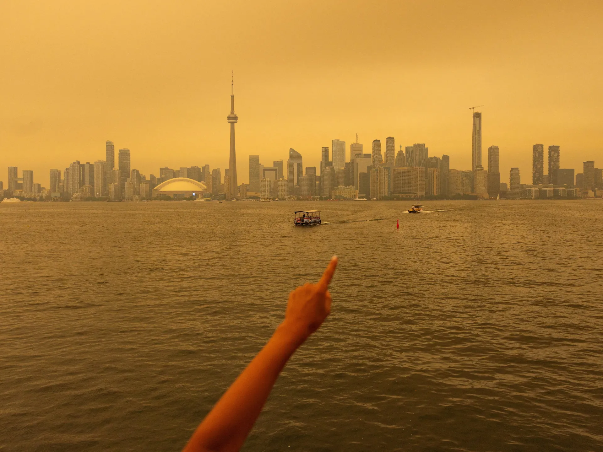 Toronto engulfed by wildfire smoke as US cities threatened